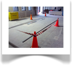 Installing a track system rolling filing system while the area is still a construction site poses some logistical problems. Taping the area off not only keeps the area clean but is also a safety factor because of the trip hazards present.