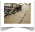 With the floor completed, and the books behind us dust free and safe, time to start building.