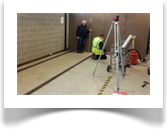 A professional dumpy level is used to find the highest point of the floor. This is where leveling of the track commences.