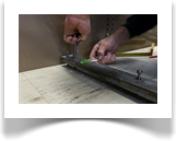 Specialist "Top Nuts", are wound down into the track using a custom tool. Leveling the track sideways is an extremely important part of this process.