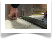 A bottom retaining nut is wound up to set the track into place, levels are again checked with the dumpy to ensure accuracy. This process is repeated for every stud holding the track.